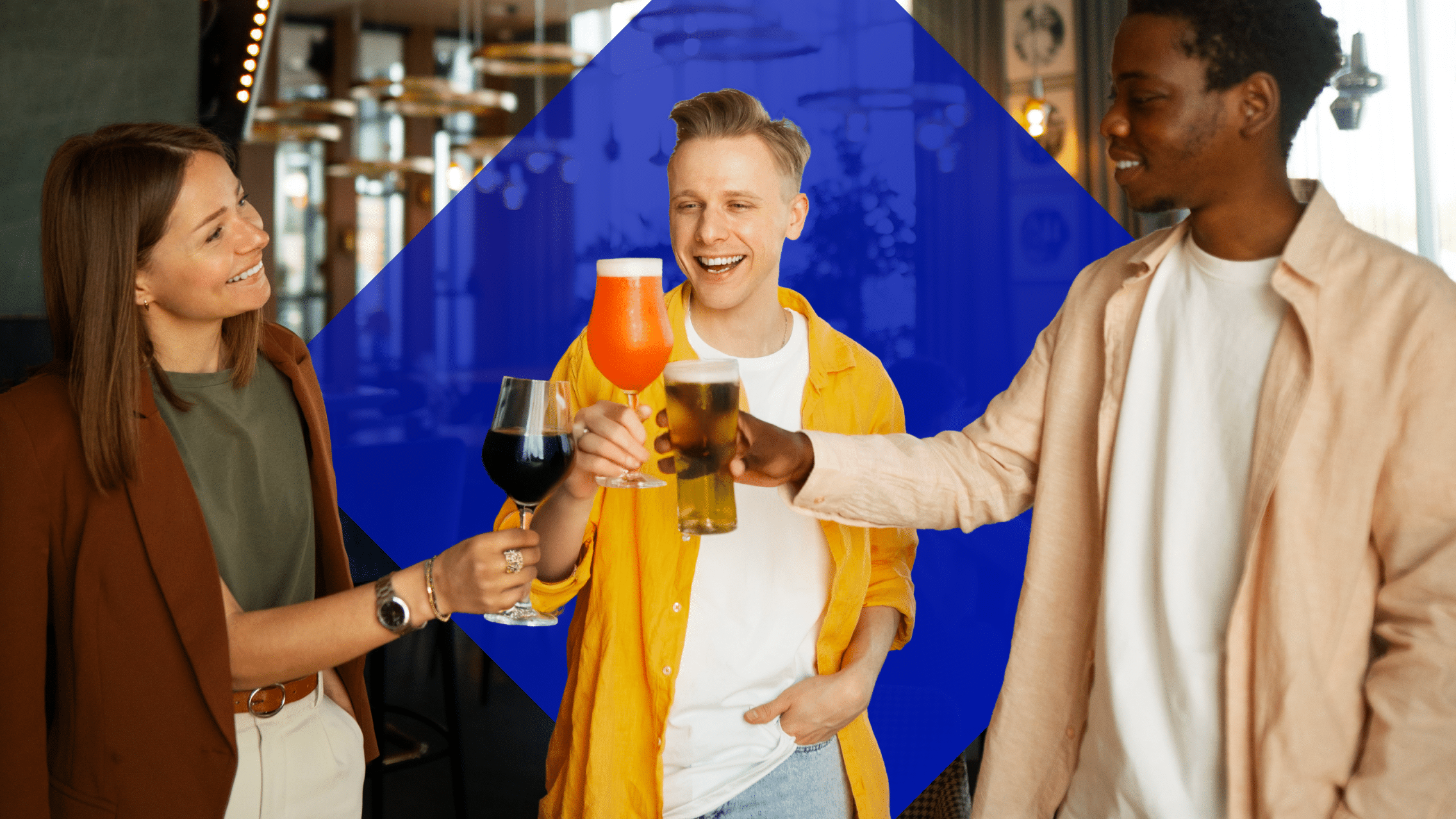A woman holding a glass of wine cheers with a guy with a glass of cocktail and the other guy with beer