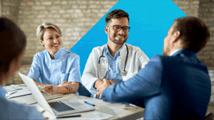 Healthcare professionals sit down to discuss the regulation for GenAI's usage in the healthcare industry