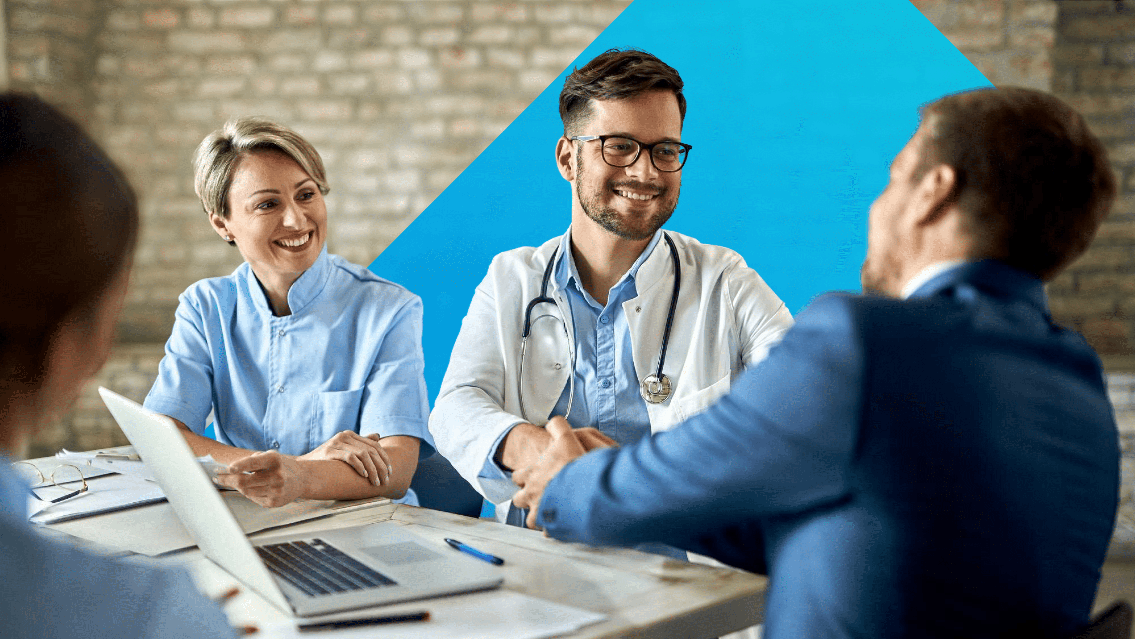 Healthcare professionals sit down to discuss the regulation for GenAI's usage in the healthcare industry